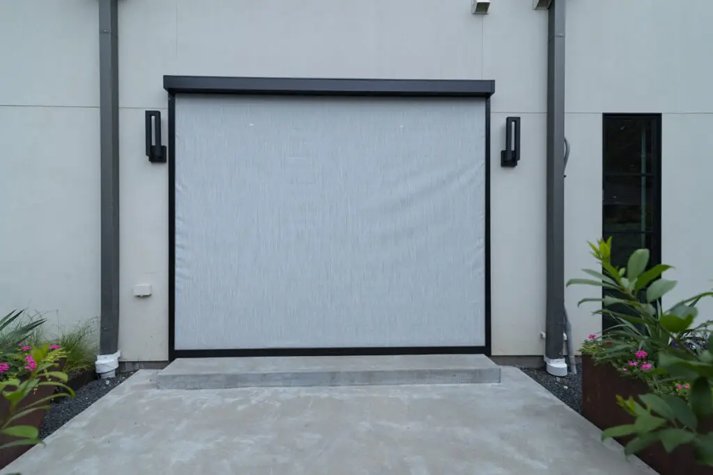 A closed Shadesol exterior Zipscreen shade installed across a large residential opening