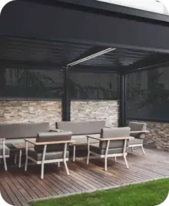 Dark Zipscreen exterior shades lowered around a covered outdoor dining patio