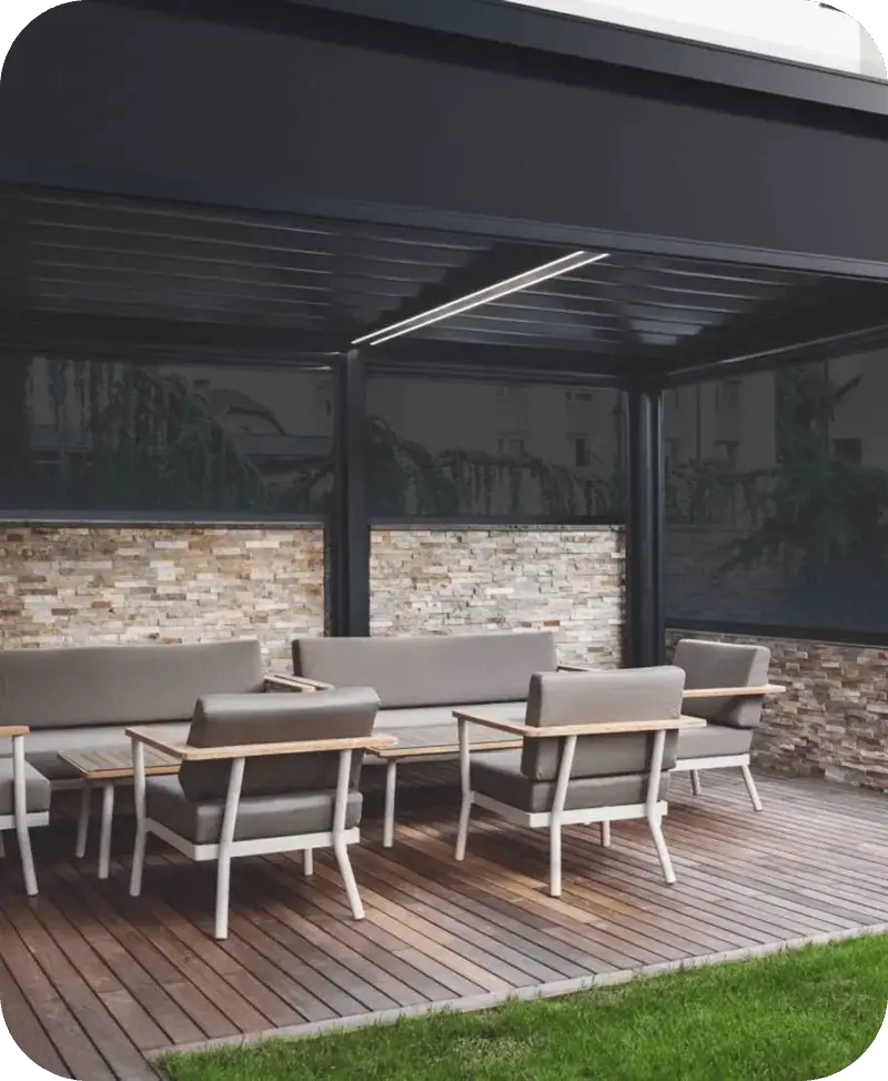 Dark Zipscreen exterior shades lowered around a covered outdoor dining patio